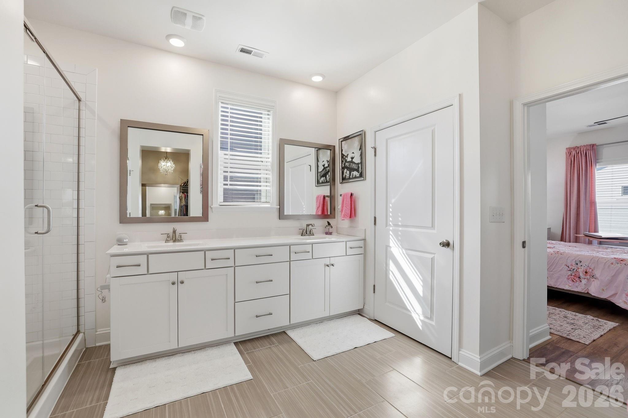 6038 Holland Street Fort Mill, SC 29707 - Photo 22 of 48 a spacious bathroom with double vanity and a mirror