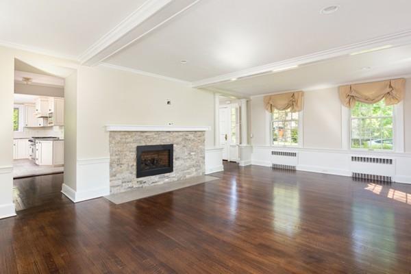 62 Arnold Road Newton, MA 02459 - Photo 6 of 17 wooden floor fireplace and windows in an empty room