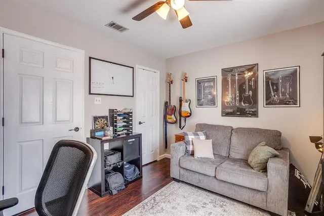 a view of a livingroom with furniture and a workspace