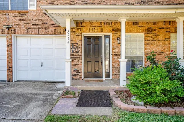 a front view of a building with garden