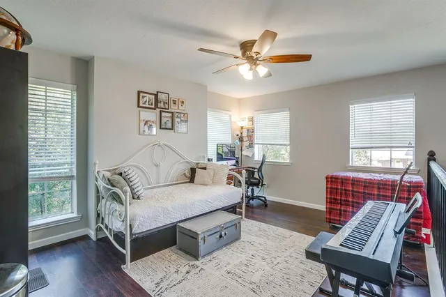 a bed room with a bed and a chandelier