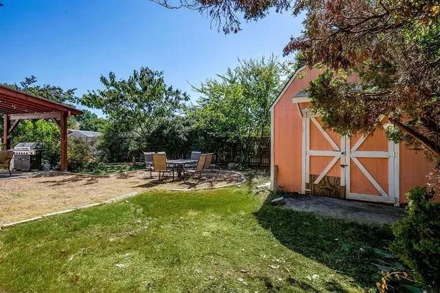 a view of a backyard with sitting area and furniture