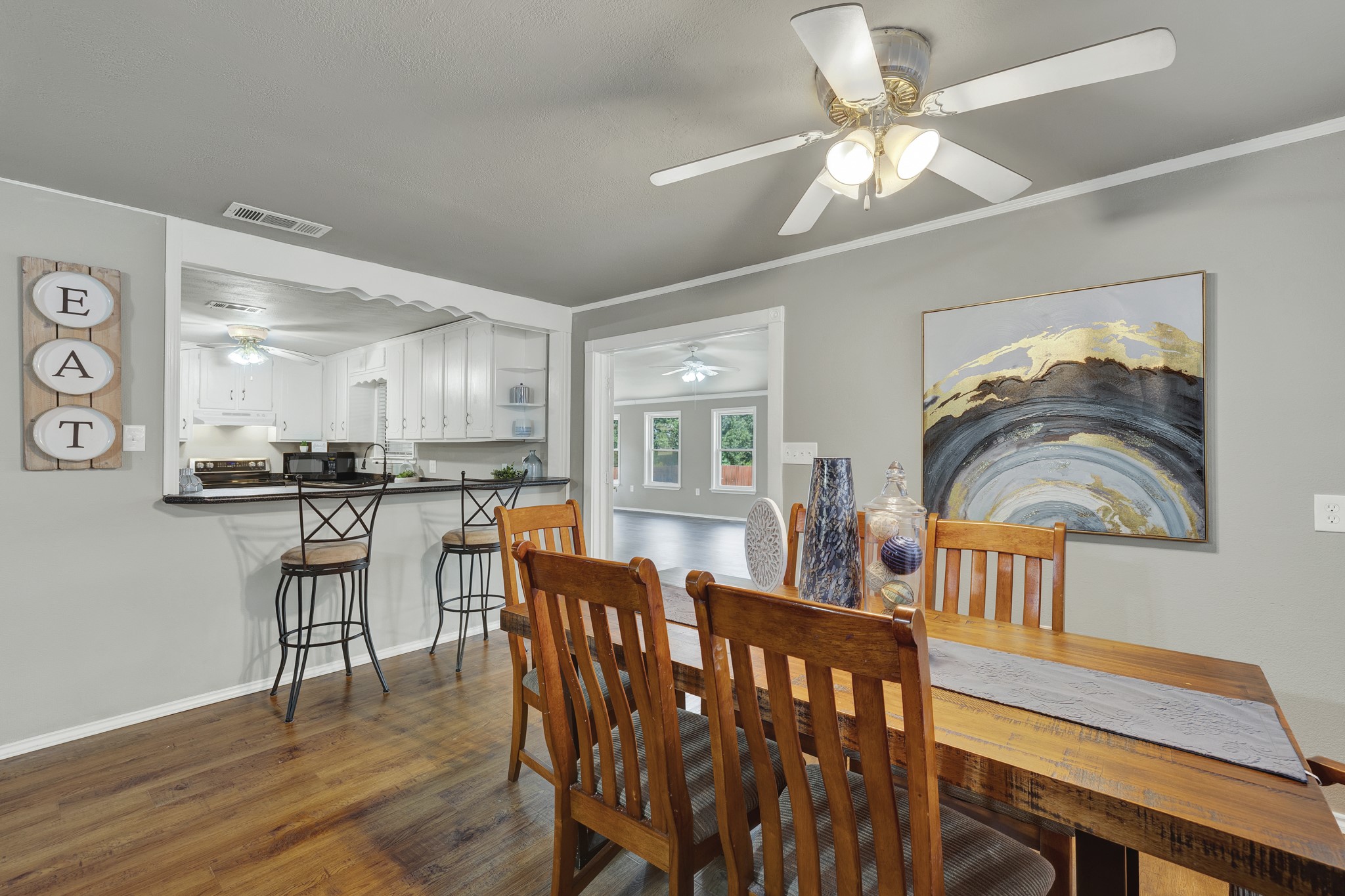 580 East Zipp Road New Braunfels, TX 78130 - Photo 5 of 45 Inviting dinning Room. The space flows into a sunlit room with large windows, creating an open, airy feel.