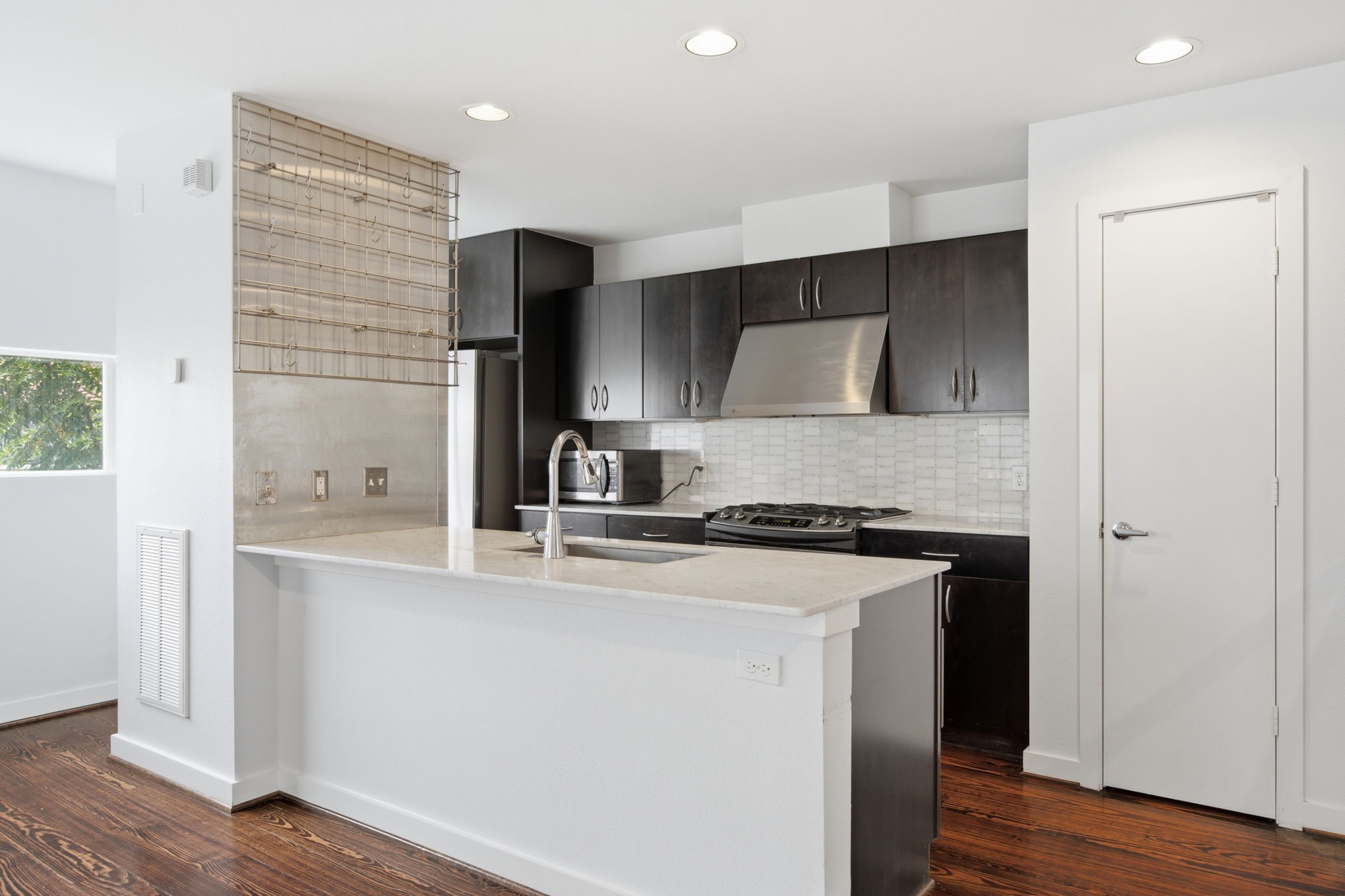 2934 Commerce Street Houston, TX 77003 - Photo 12 of 44 a kitchen with a sink a stove and refrigerator