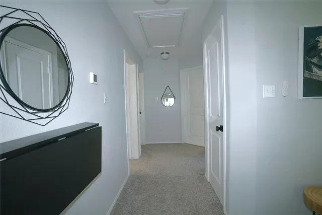 a view of a bathroom with a sink and a mirror