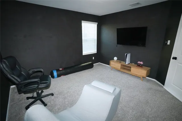 a living room with a couch and a flat screen tv