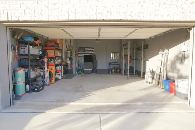 a view of a garage with rack and bicycle