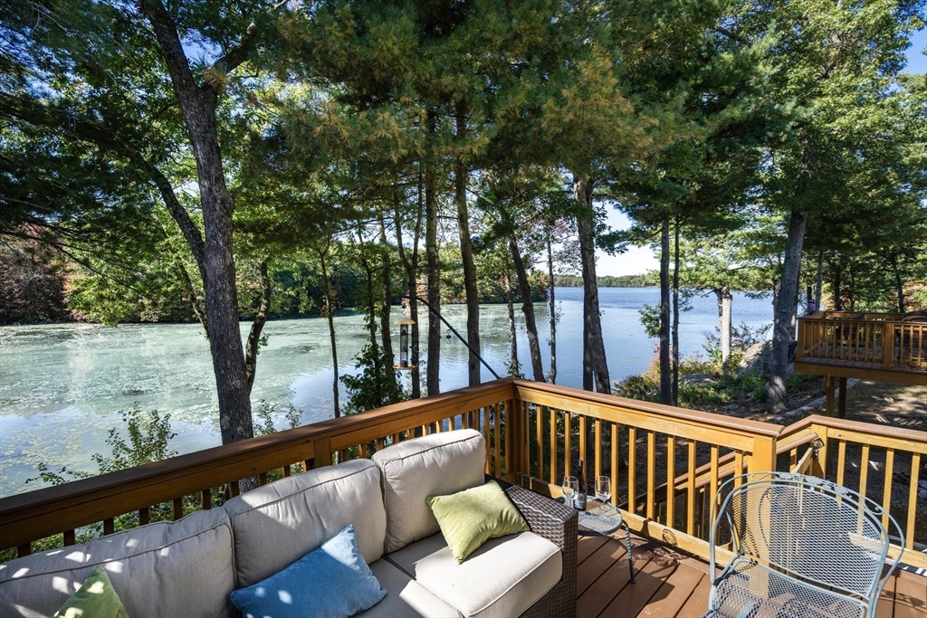 a view of a two chairs in the balcony