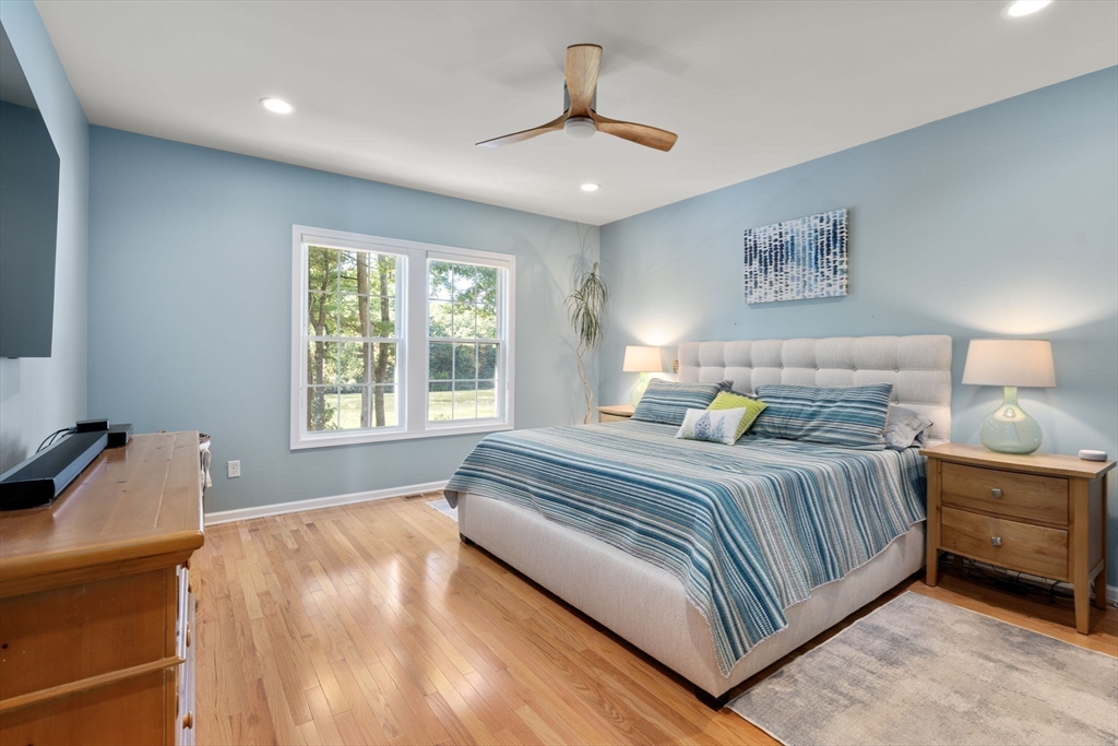 14 Iris Court, Unit 14 Canton, MA 02021 - Photo 15 of 42 a bedroom with a bed and a couch