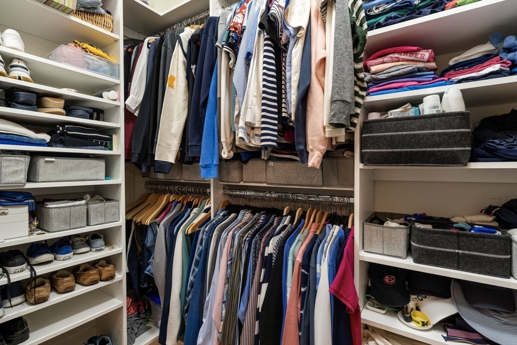 14 Iris Court, Unit 14 Canton, MA 02021 - Photo 19 of 42 a view of walk in closet with clothes and shoes