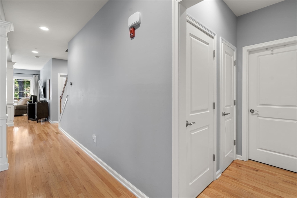 14 Iris Court, Unit 14 Canton, MA 02021 - Photo 20 of 42 a view of a hallway with wooden floor and closet