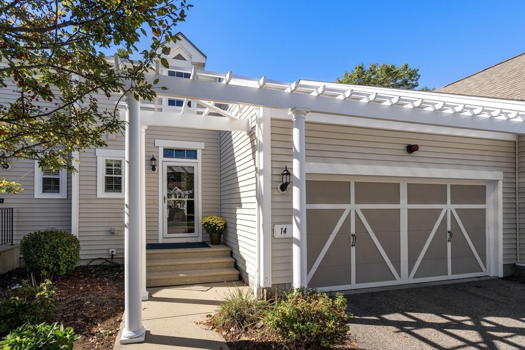 14 Iris Court, Unit 14 Canton, MA 02021 - Photo 2 of 42 a front view of a house with garden