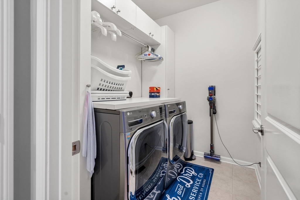 14 Iris Court, Unit 14 Canton, MA 02021 - Photo 21 of 42 a view of a storage and utility room with washer and dryer