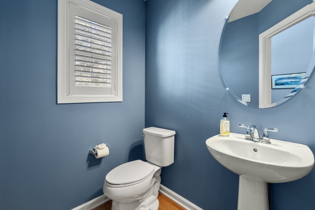 14 Iris Court, Unit 14 Canton, MA 02021 - Photo 22 of 42 a bathroom with a toilet a sink and mirror