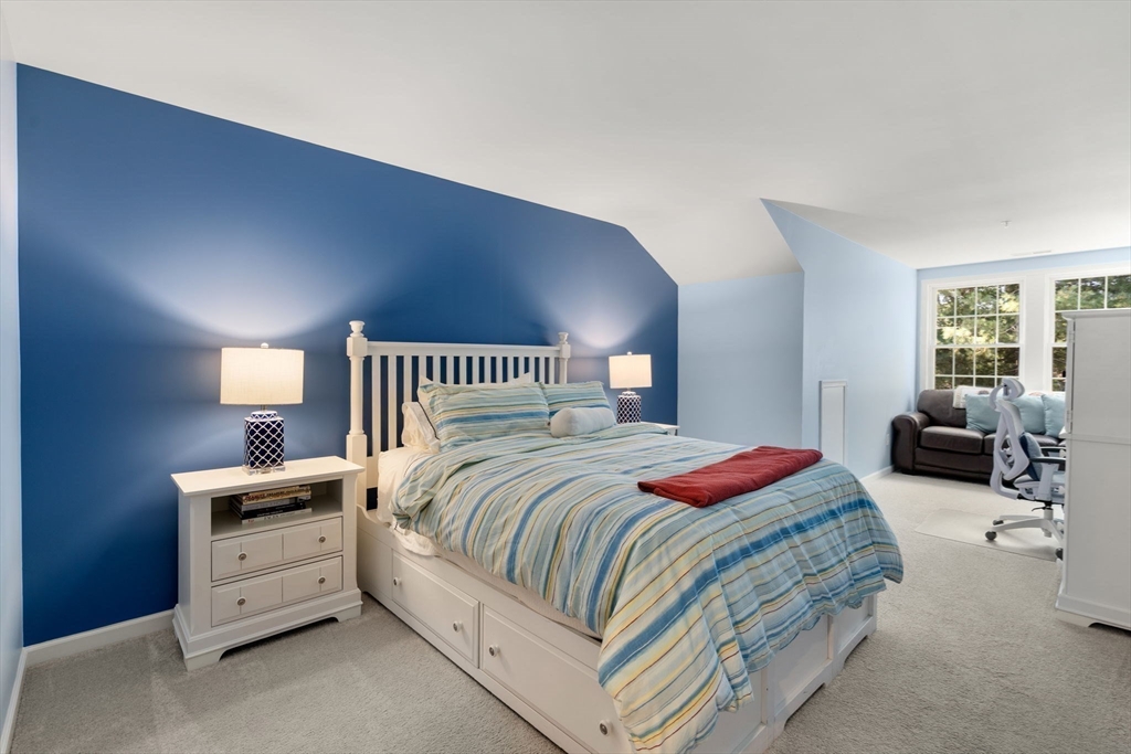 14 Iris Court, Unit 14 Canton, MA 02021 - Photo 24 of 42 a bedroom with a bed and a couch