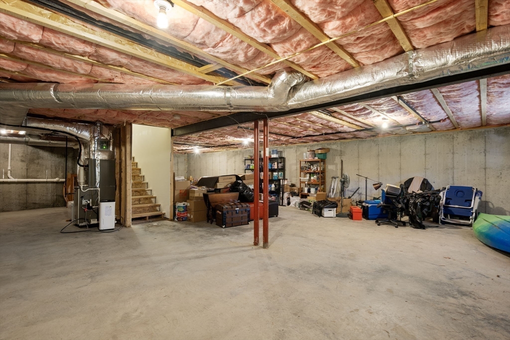 14 Iris Court, Unit 14 Canton, MA 02021 - Photo 28 of 42 a view of a garage with a bike and car