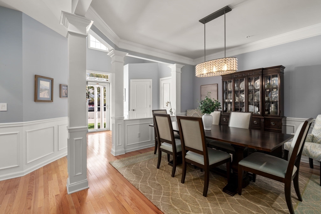 14 Iris Court, Unit 14 Canton, MA 02021 - Photo 3 of 42 a view of a dining room with furniture window and wooden floor