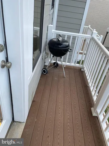 a view of balcony with wooden floor
