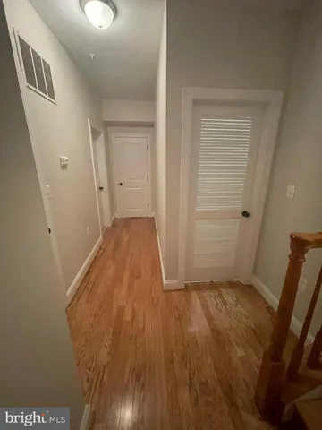 wooden floor in a hall with an entryway