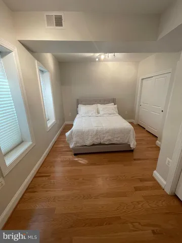 a bedroom with a bed and window