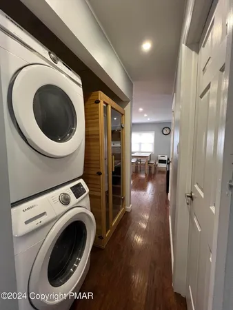 a view of a hallway with washer and dryer