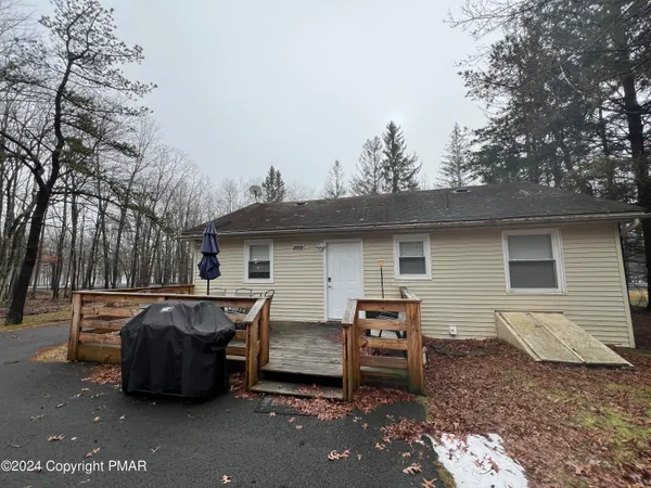 a view of a patio in backyard
