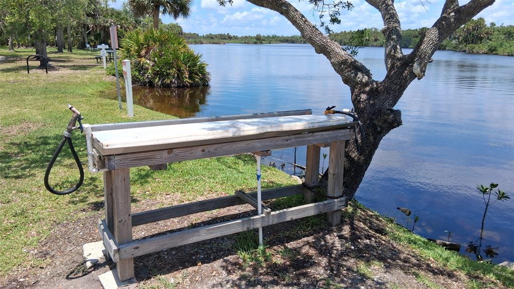 1300 State Rte 777, Unit W 86 Venice, FL 34293 - Photo 11 of 15 a backyard of a house with wooden floor and plants