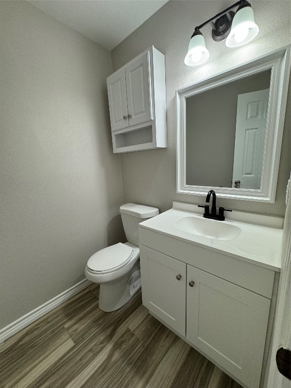 12804 Copper Cliff Avenue, Unit B Austin, TX 78727 - Photo 14 of 29 a bathroom with a toilet a sink and mirror