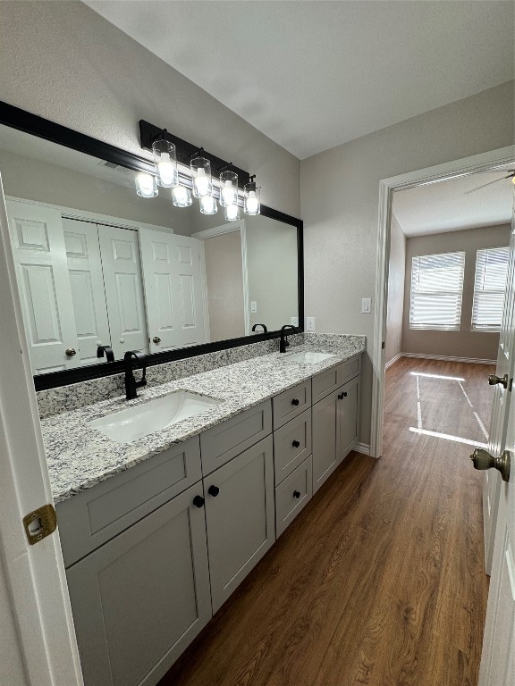 12804 Copper Cliff Avenue, Unit B Austin, TX 78727 - Photo 18 of 29 a bathroom with a granite countertop double vanity sink and mirror