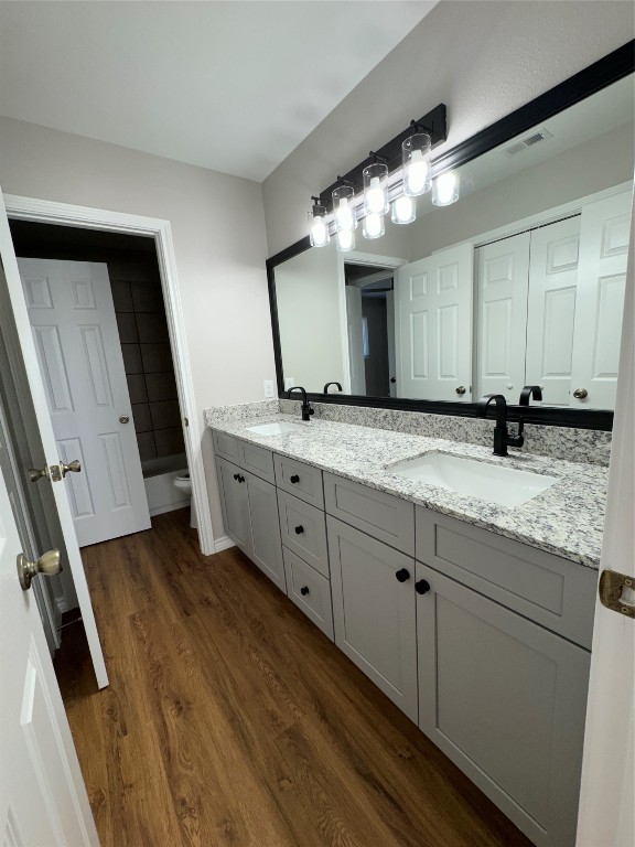 12804 Copper Cliff Avenue, Unit B Austin, TX 78727 - Photo 19 of 29 a spacious bathroom with a granite countertop sink and a mirror
