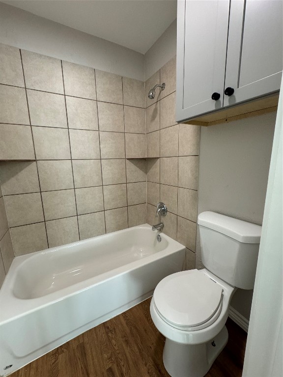 12804 Copper Cliff Avenue, Unit B Austin, TX 78727 - Photo 20 of 29 a white toilet and tub sitting next to a bathroom sink
