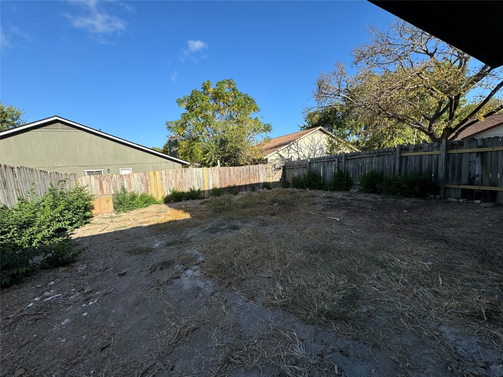 12804 Copper Cliff Avenue, Unit B Austin, TX 78727 - Photo 26 of 29 a front view of a house with a yard