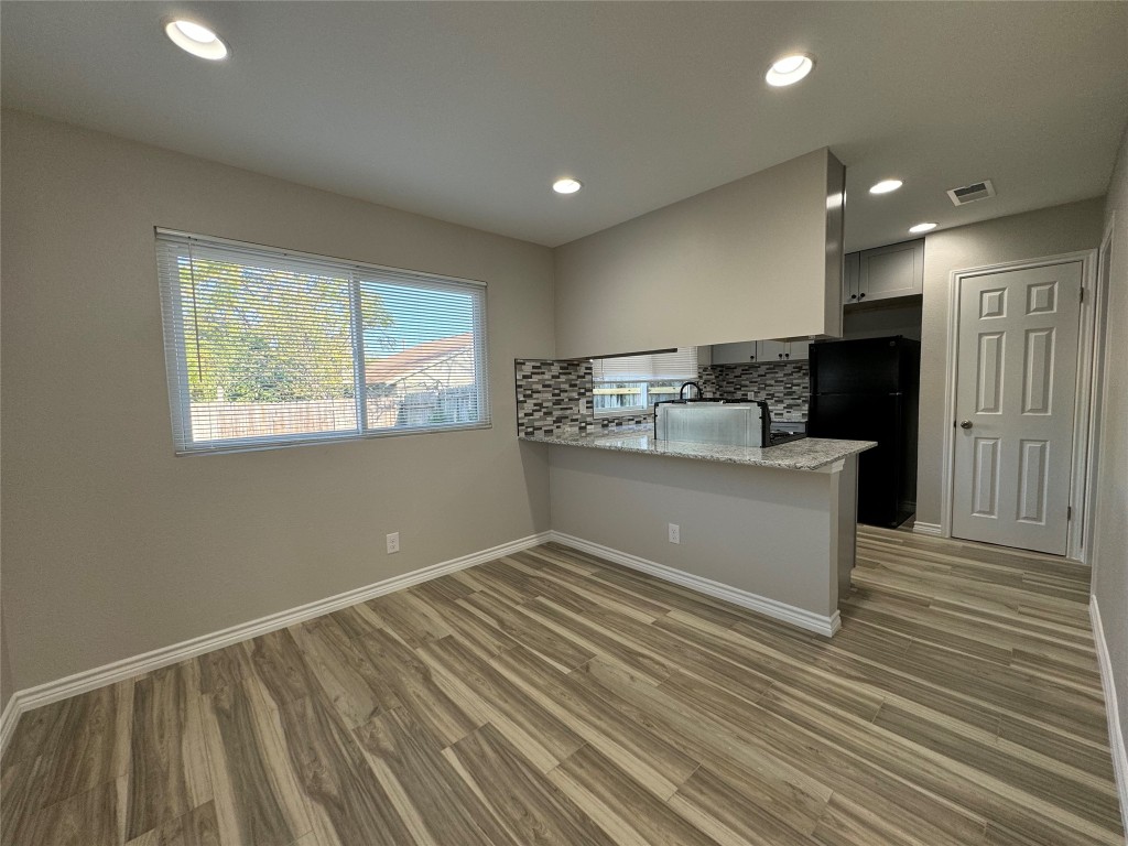 12804 Copper Cliff Avenue, Unit B Austin, TX 78727 - Photo 7 of 29 a view of kitchen with refrigerator and window