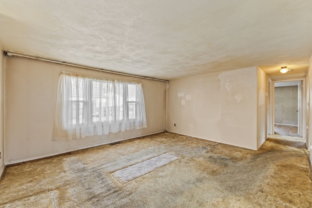 2 Alwin Street Boston, MA 02136 - Photo 12 of 43 a view of an empty room with a window