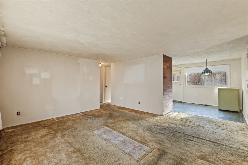 2 Alwin Street Boston, MA 02136 - Photo 13 of 43 a view of a livingroom with wooden floor and cabinet