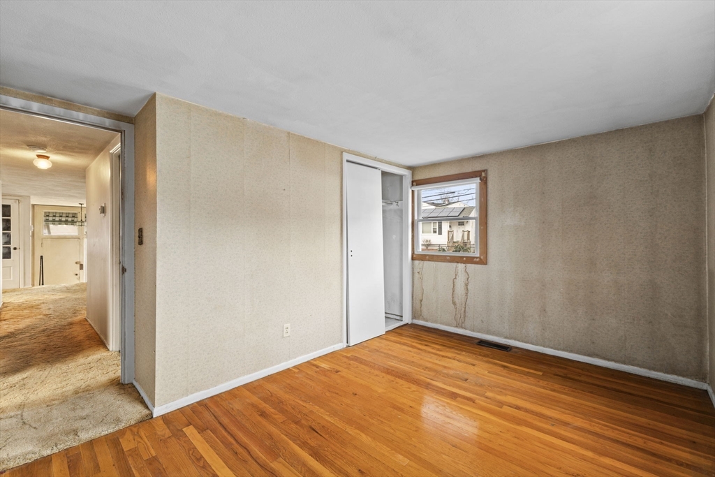 2 Alwin Street Boston, MA 02136 - Photo 24 of 43 a view of empty room with wooden floor
