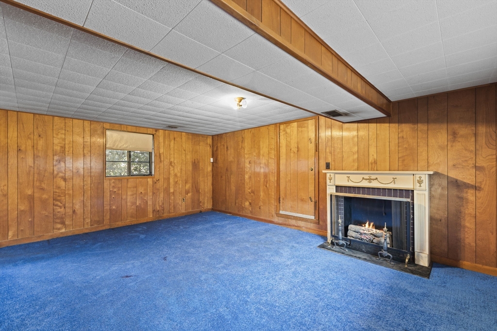 2 Alwin Street Boston, MA 02136 - Photo 35 of 43 a view of an empty room with a fireplace and a window
