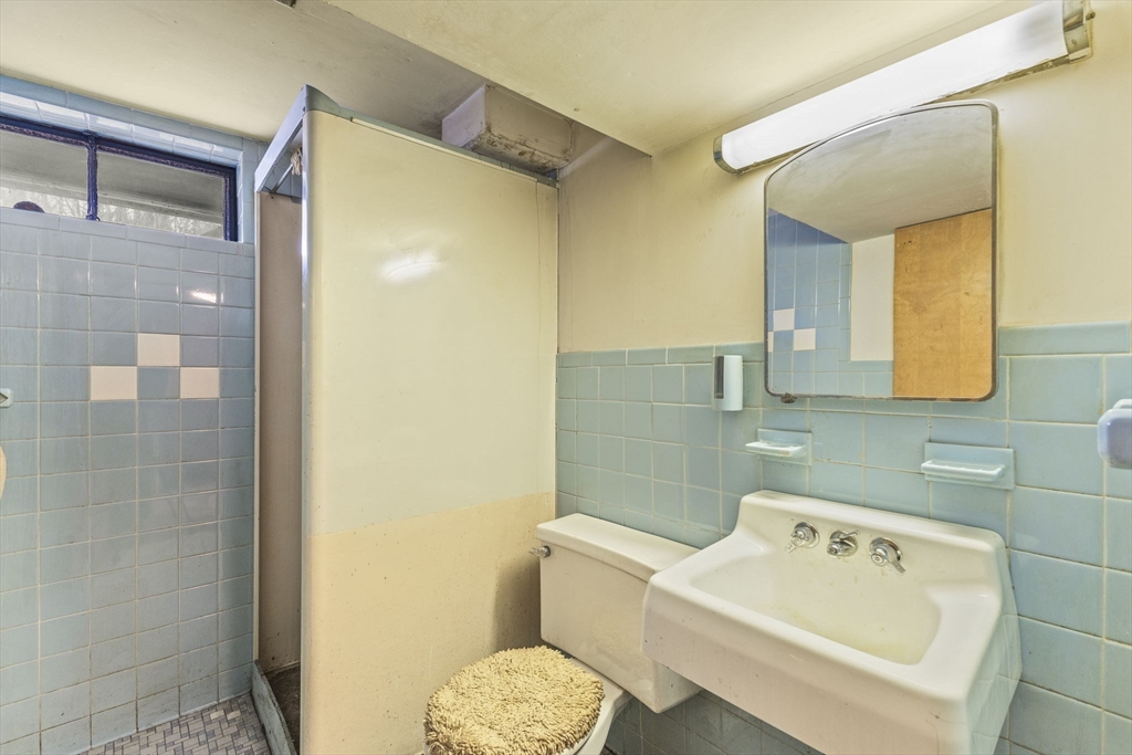 2 Alwin Street Boston, MA 02136 - Photo 36 of 43 a bathroom with a sink toilet and shower