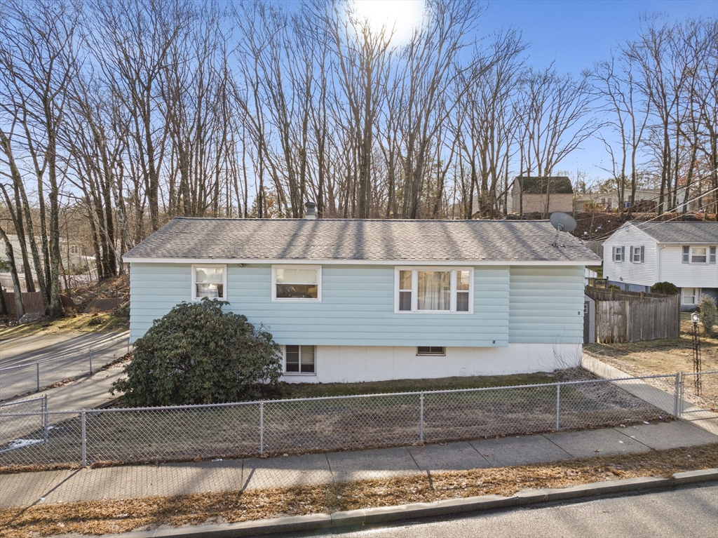 2 Alwin Street Boston, MA 02136 - Photo 4 of 43 front view of a house with a bench