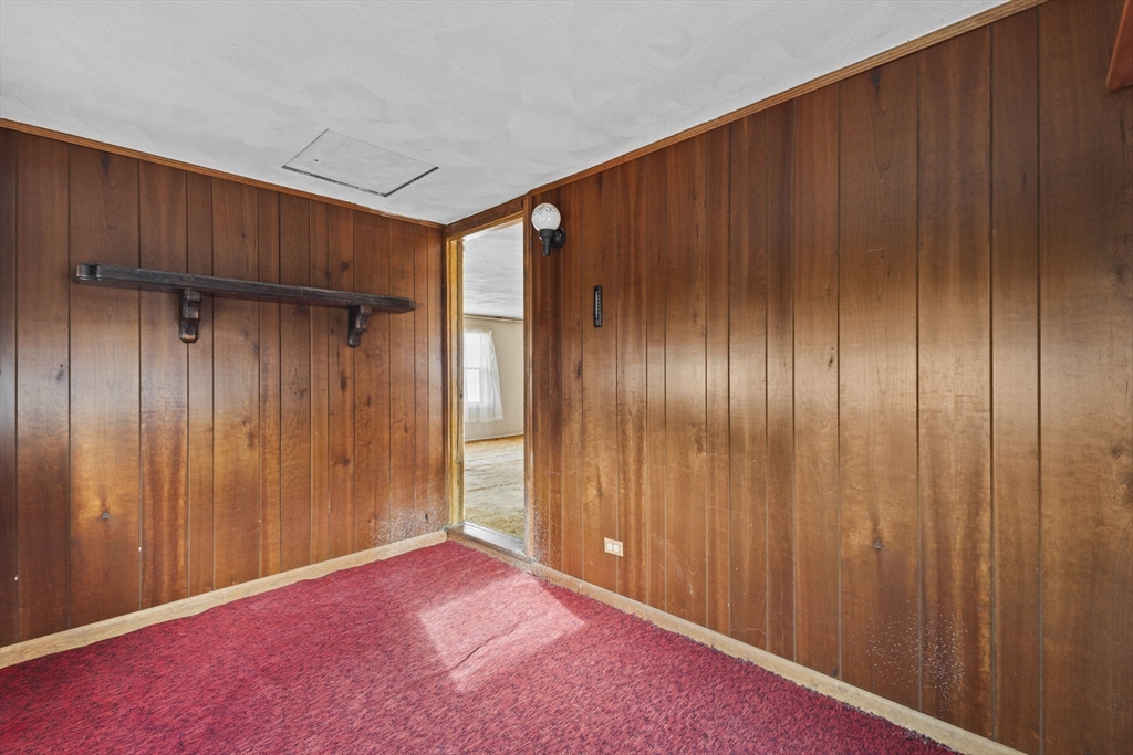 2 Alwin Street Boston, MA 02136 - Photo 10 of 43 a view of an empty room with wooden walls