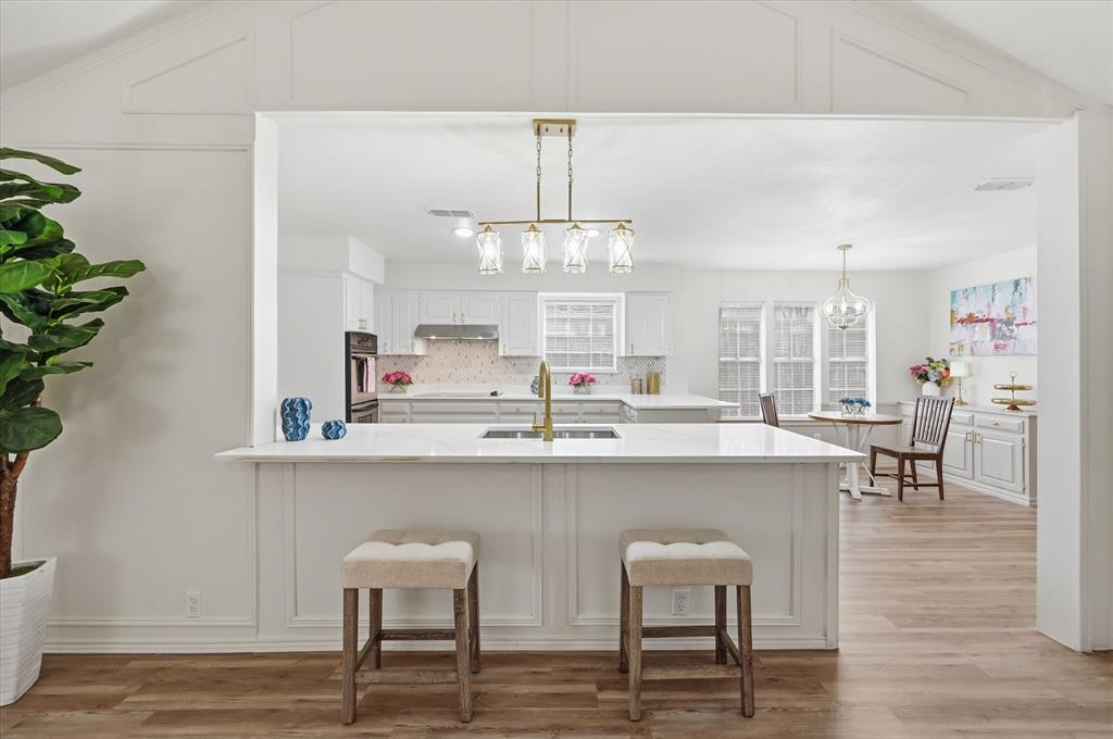 5808 Ridge Drive Arlington, TX 76016 - Photo 15 of 40 a kitchen with cabinets table and chairs