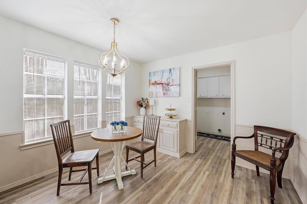 5808 Ridge Drive Arlington, TX 76016 - Photo 20 of 40 a view of a dining room with furniture window and wooden floor