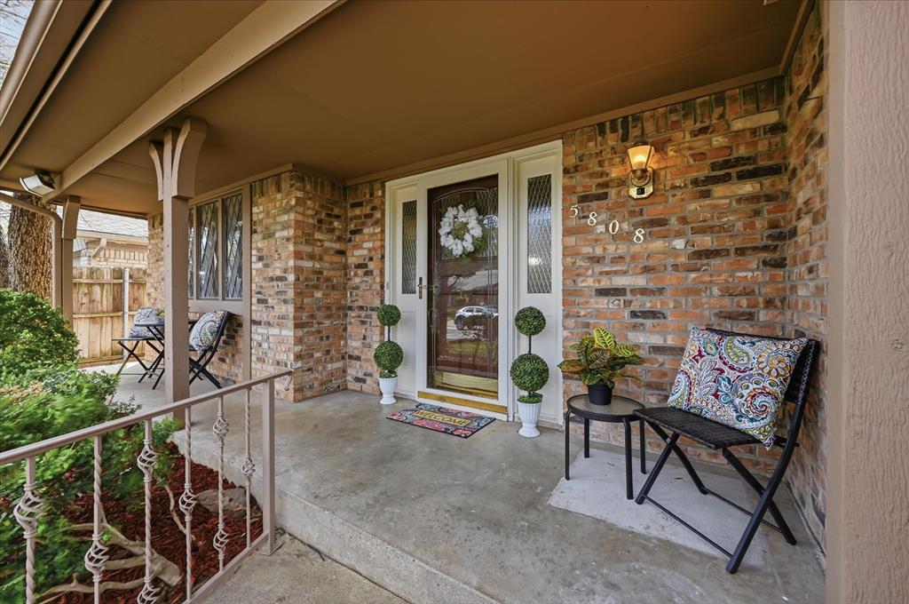 5808 Ridge Drive Arlington, TX 76016 - Photo 2 of 40 a balcony view with a glass door