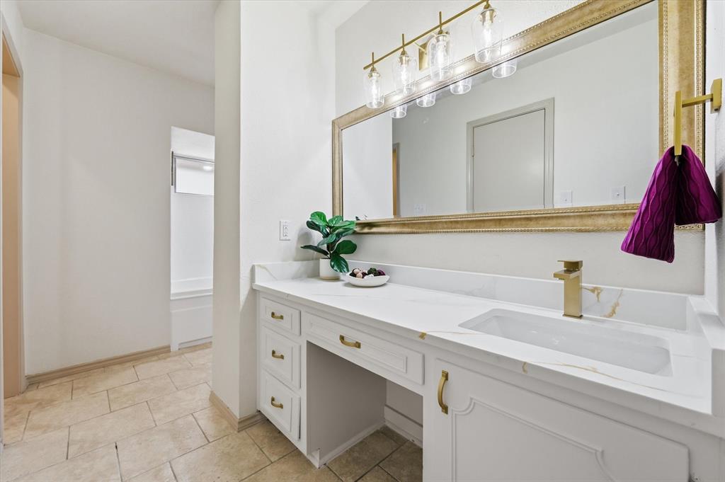 5808 Ridge Drive Arlington, TX 76016 - Photo 30 of 40 a bathroom with a sink and a mirror