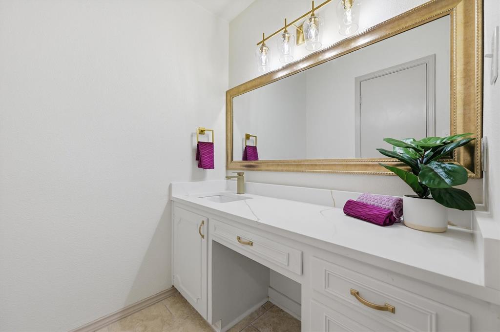 5808 Ridge Drive Arlington, TX 76016 - Photo 33 of 40 a bathroom with a sink and a mirror