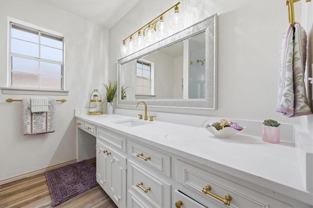 5808 Ridge Drive Arlington, TX 76016 - Photo 35 of 40 a bathroom with a sink and a mirror