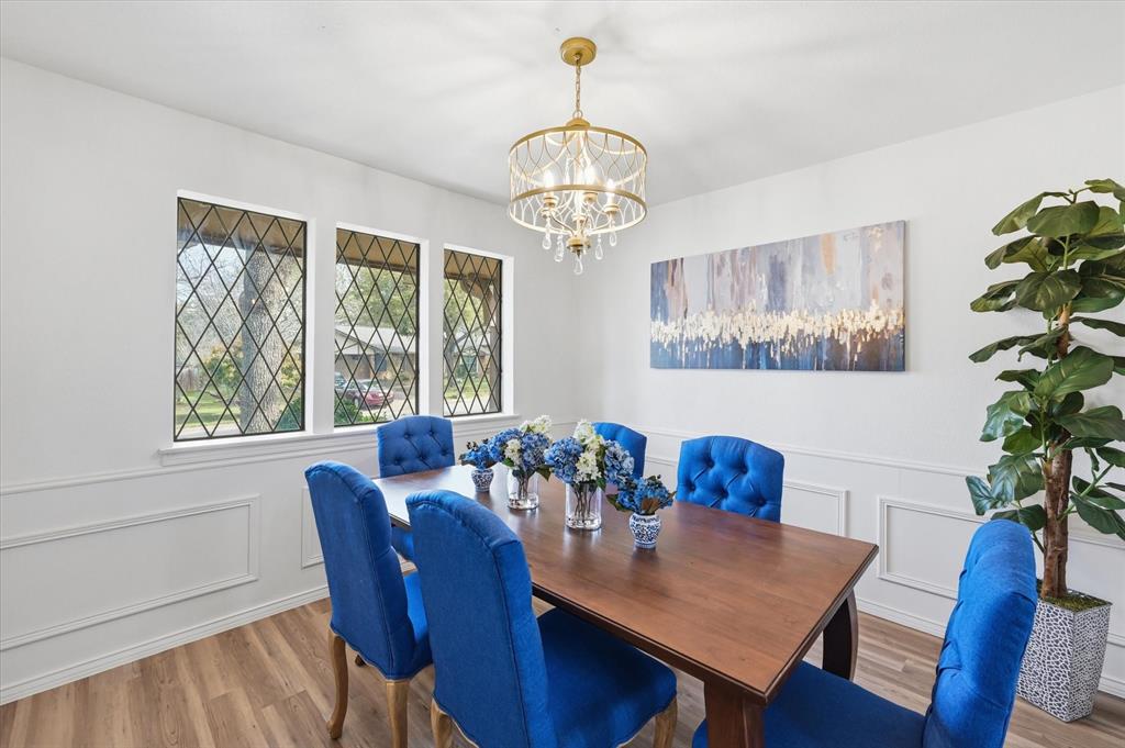 5808 Ridge Drive Arlington, TX 76016 - Photo 9 of 40 a view of a dining room with furniture window and wooden floor