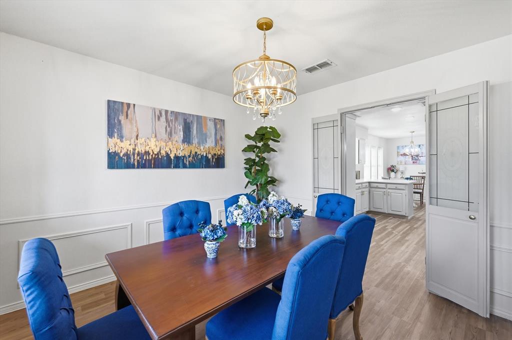 5808 Ridge Drive Arlington, TX 76016 - Photo 10 of 40 a view of a dining room with furniture and wooden floor