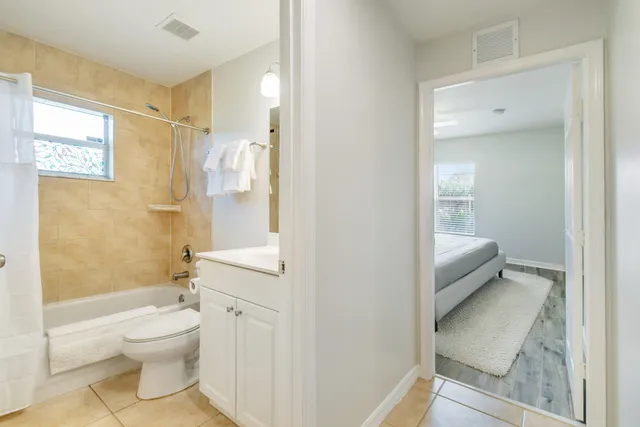 a bathroom with a toilet sink and shower