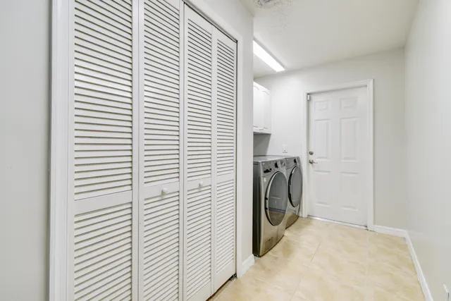 a view of a storage & utility room with a washer dryer